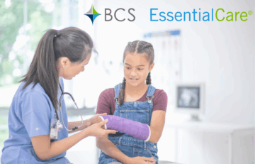 Doctor wraps girls broken wrist.